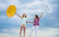 Weather forecast. Weather changing. Carefree children outdoors. Ready for any weather. Girls friends with umbrellas