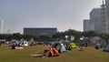 Shenzhen, China: it`s sunny and warm. Citizens relax on the park lawn, some set up tents, and the family is enjoying their leisure