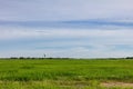 Weather radar at aeronautical meteorological station for information for air traffic with green field on blue sky background in Royalty Free Stock Photo