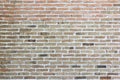 Weather stained old brick wall background