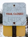 Weather-stained sign 'Trail closed'