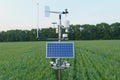 Weather station in grass field, 5G technology with smart farming concept