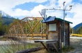 A weather station beside a river bridge in the springtime