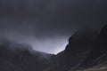 Low clouds rolling over mountain ridge Royalty Free Stock Photo