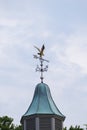 Weather vane with an eagle in flight Royalty Free Stock Photo