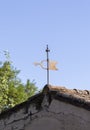 Weather vane on the roof indicating the wind direction