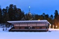 Football field and church in the evening of winter Royalty Free Stock Photo