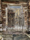 Weatherd wooden door of an old log house