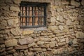 Weathered Abandoned Building Exterior with Damaged Walls and Old Windows. Place of imprisonment, Prison with the old window Royalty Free Stock Photo