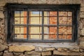 Weathered Abandoned Building Exterior with Damaged Walls and Old Windows. Place of imprisonment, Prison with the old window Royalty Free Stock Photo