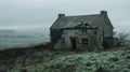 A weathered abandoned cottage standing at the edge of the moors. Its windows are cracked and broken and the ivycovered Royalty Free Stock Photo