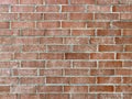 Weathered aged old close vintage red brick alley building wall retro architectural background