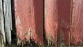 Weathered Barn Wood painted red fading old grey