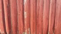 Weathered Barn Wood painted red fading old grey