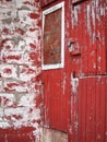 Weathered Barn Wood painted red fading old grey