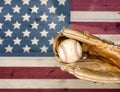 Weathered baseball mitt and ball with faded boards painted in Am Royalty Free Stock Photo