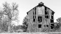 Battered old barn collapsing in black and white Royalty Free Stock Photo