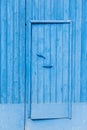 Weathered blue wood warehouse door pattern and texture for background Royalty Free Stock Photo