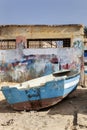 Weathered boat parked on the beach of Sal Rei on Boa Vista