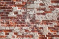 Weathered brick wall with red and light-colored bricks Royalty Free Stock Photo