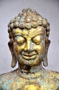 Weathered bronze buddha head statue