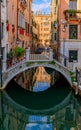 Weathered building facade on a picturesque canal in Venice Italy