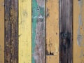 Weathered colorful wooden planks arranged on wall