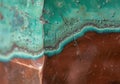 Weathered copper sheet with vibrant green patina and intricate surface texture Royalty Free Stock Photo