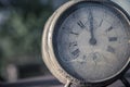 Weathered and dirty vintage retro clock showing midnight or noon Royalty Free Stock Photo