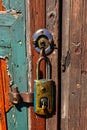 Weathered wooden door ancient padlock secure entry