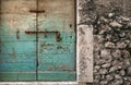 Weathered door with fading, turquoise paint Royalty Free Stock Photo