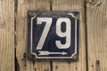 Weathered enameled plate number 79