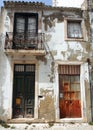 Weathered facade of the white residential townhouse in the old town, Santarem, Portugal