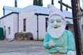 Weathered Garden Gnome With Desert Town Farmhouse