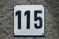 Weathered enameled plate number 115