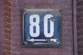 Weathered enamelled plate number 80