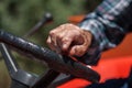 Weathered Hand of Farmer Driving his Tractor Royalty Free Stock Photo