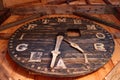 Wooden Clock Face Hangs on Wall
