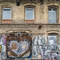 Weathered Industrial Building With Multiple Graffiti Murals, Street Art in Berlin Royalty Free Stock Photo