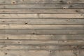 Horizontal weathered knotted wood planks wall. Rustic wooden texture grain knots boards background Royalty Free Stock Photo