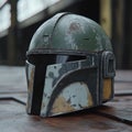 Weathered Mandalorian Helmet on Outdoor Surface Royalty Free Stock Photo
