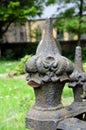 Weathered metal fence finials