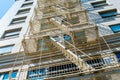 Fire escape on tall building viewed from below Royalty Free Stock Photo