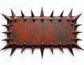 Weathered metal plate featuring sharp spikes on edges, isolated on white background. Rustic, industrial design element suggests Royalty Free Stock Photo