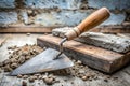 Weathered Metal Trowel Ready for Masonry Work A Rustic Tool Awaits Its Task on Aged Concrete Beside a Royalty Free Stock Photo