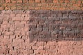 Weathered old brick wall painted brown paint. Abstract background Royalty Free Stock Photo