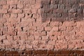 Weathered old brick wall painted brown paint. Abstract background Royalty Free Stock Photo