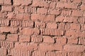 Weathered old brick wall painted brown paint. Abstract background Royalty Free Stock Photo