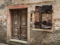 Weathered old door and shutters of a stone house in Cres Royalty Free Stock Photo