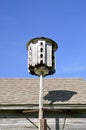 Weathered old rounded apartment birdhouse Royalty Free Stock Photo